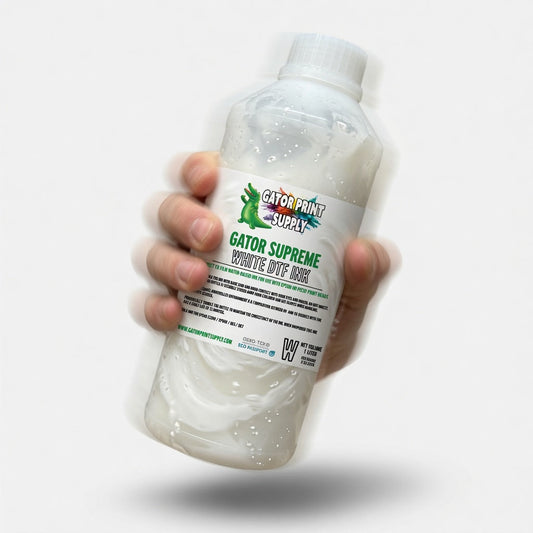 bottle of white dtf ink being shaken